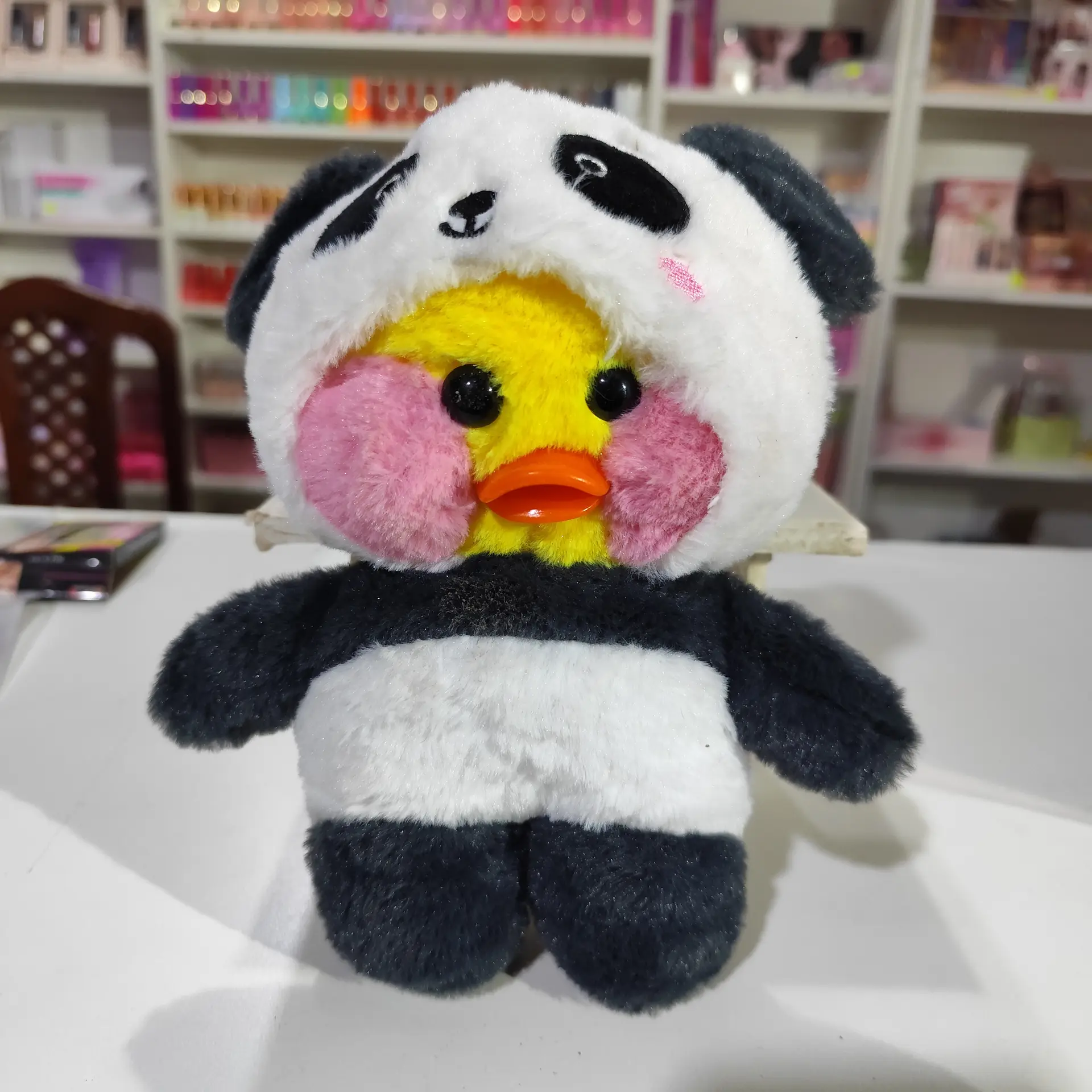 Peluche pato con pijama panda
